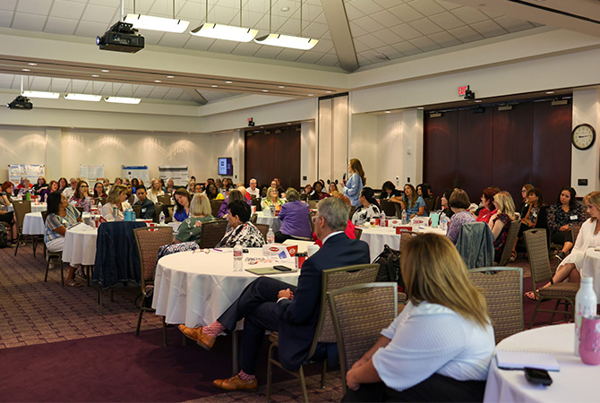 Texas Doctor of Nursing Practice Conference attendees listening to a speaker